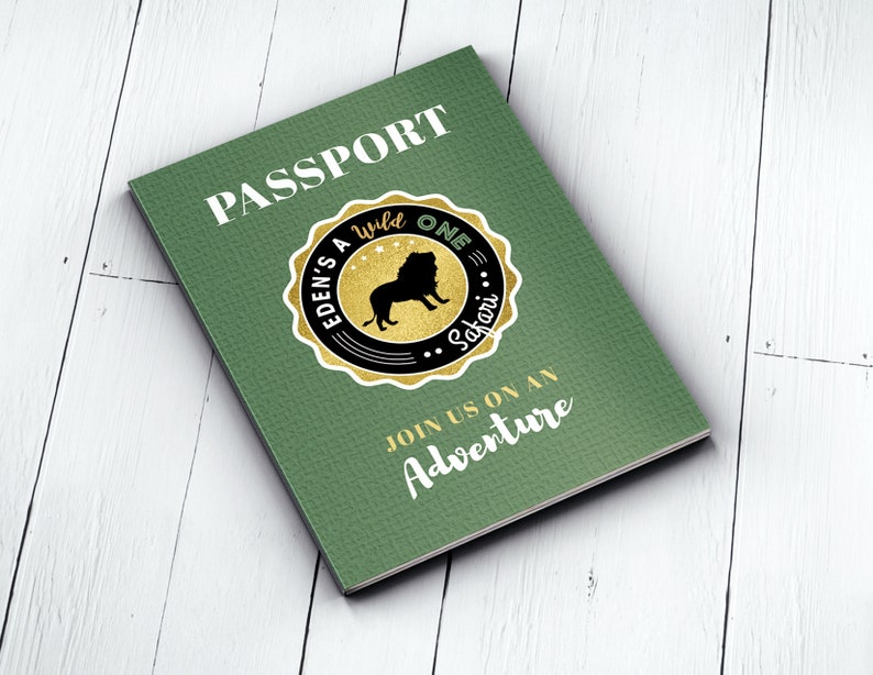 May include: Green passport-style invitation with the text "PASSPORT" in gold lettering. A gold circle with a black border and the text "EDEN'S WILD ONE SAFARI" surrounds a black silhouette of a lion. The text "JOIN US ON AN ADVENTURE" is printed in gold lettering.