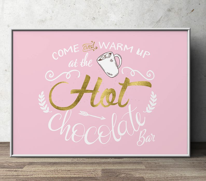 May include: Pink sign with gold lettering that reads "Come and warm up at the Hot Chocolate Bar". A gold mug with marshmallows is pictured above the text.