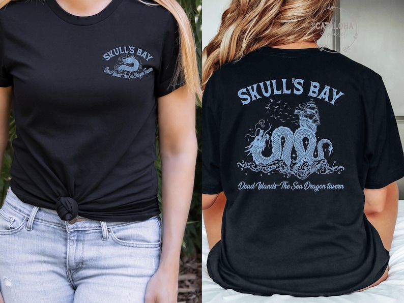 May include: Black t-shirt with a light blue graphic on the front and back. The front features the text "SKULL'S BAY" and "Dead Islands The Sea Dragon Tavern". The back has a dragon and ship design with the same text.