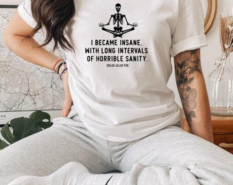 May include: White t-shirt with a black skeleton meditating and the text "I became insane, with long intervals of horrible sanity. Edgar Allan Poe"