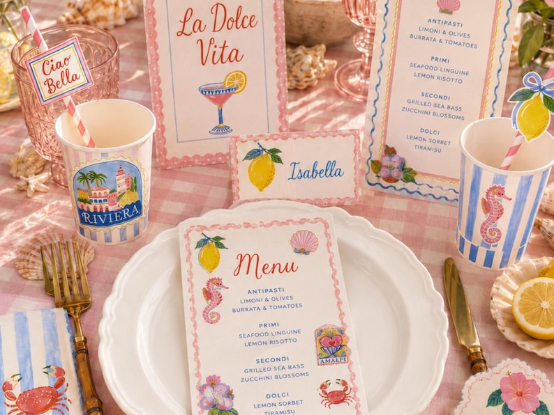Coastal Italian party tableware mockup featuring watercolor clipart used on printable menu cards, place cards, paper cups, straw tags, napkins, and party decorations. Styled with pink gingham, lemons, shells, glassware, and pastel seaside details, perfect for showing invitation designs and printable party decor.