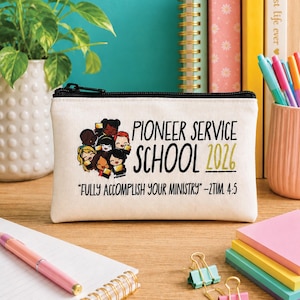 May include: A zippered canvas pouch with the text "Pioneer Service School 2026" and the quote "Fully Accomplish Your Ministry." The pouch features an illustration of diverse people. The background includes books, pens, and a plant.