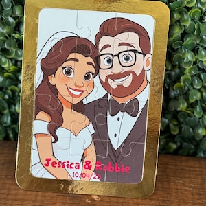 May include: A personalized wedding puzzle featuring a cartoon illustration of a bride and groom. The puzzle has a gold border and includes the names "Jessica & Robbie" and the date "10/04/25" in pink text. The bride wears a white dress and veil.