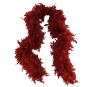 May include: A long, red feather boa. The boa is made of soft, fluffy feathers and is perfect for adding a touch of glamour to any outfit.