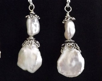 White Fresh Water large Petal and Keishi shaped Pearl earrings .