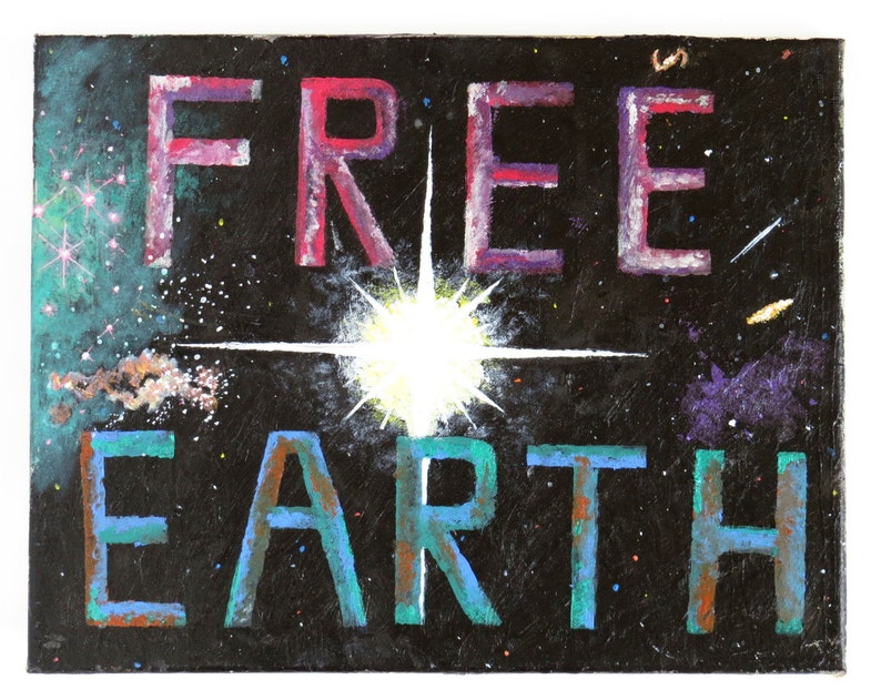 May include: A black canvas painting with a white starburst in the center. The words "FREE EARTH" are painted in blue and green on the bottom of the canvas. The words "FREE" are painted in pink and purple on the top of the canvas. The background is a dark blue with white stars.