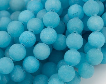 Peut inclure: Un brin de perles rondes en pierre précieuse bleu clair. Les perles sont lisses et ont une finition mate.