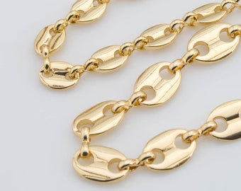 May include: A gold chain necklace with a mariner link design. The chain is made of oval-shaped links with a smooth finish.