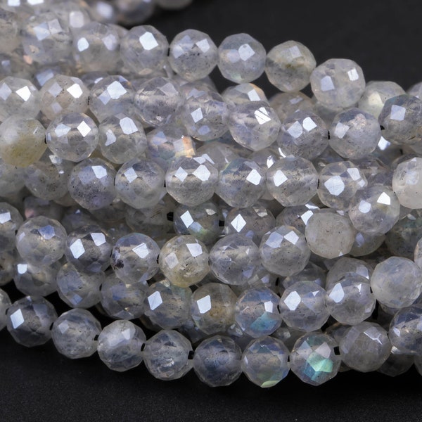 May include: A strand of faceted, iridescent labradorite beads. The beads are a light gray color with a subtle shimmer.