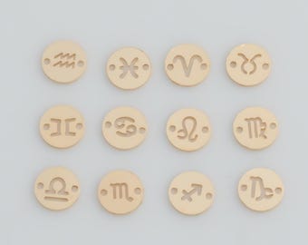 May include: Twelve small, circular, gold-toned metal charms arranged in a grid. Each charm features a unique, laser-cut zodiac sign symbol and two tiny holes on opposite sides for attachment, representing the twelve astrological constellations.