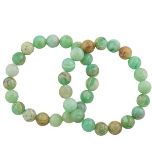 May include: Two green and brown gemstone bracelets with round beads.