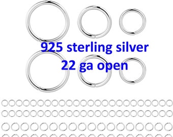 May include: A set of 100 sterling silver open jump rings, 22 gauge. The rings are shown in three sizes, with a close-up of the smallest size.