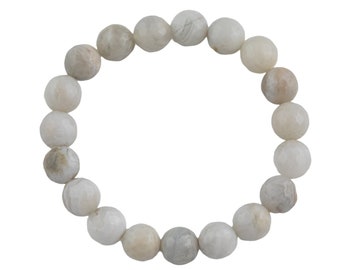 May include: A white gemstone bracelet with round beads.