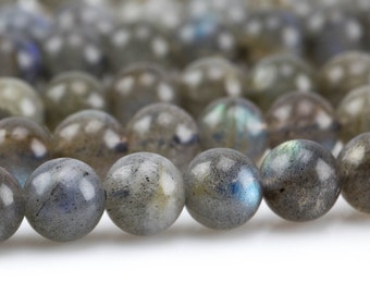 May include: A strand of gray labradorite gemstone beads. The beads are round and have a smooth, polished finish. The labradorite has a iridescent sheen, with flashes of blue, green, and gold.