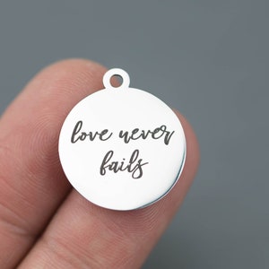 Stainless Steel Charms -- Love never fails - Laser Engraved Silver Tone - Bulk Pricing