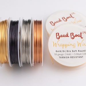 May include: Four spools of tarnish-resistant wrapping wire in gold, black, silver, and copper. The spools are labeled "Bead Boat Wrapping Wire" and "Gold/Or/Oro Soft Round 18 gauge (1mm) - 3.06yd/2.8m"