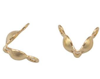 May include: Two gold-tone metal clasps for jewelry making. Each clasp has a V-shape with a rounded opening.