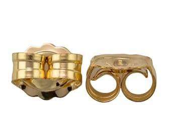 May include: A pair of gold-toned earring backs. The backs are designed to secure earrings in place.