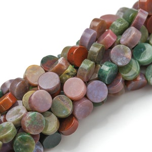 May include: A strand of round, flat, multi-colored agate beads. The beads are a mix of green, brown, red, and purple.
