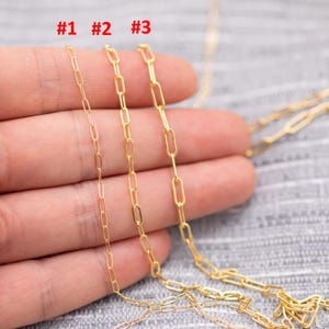 May include: Three gold-colored chain necklaces with different link styles are displayed. The chains are labeled #1, #2, and #3. The chains are shown against a neutral background.