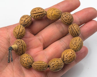 Pulsera de semillas de nuez - Talla única - Con cordón elástico resistente - Pulsera de oración budista - 14 x 19 mm