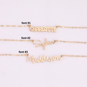 May include: Three gold necklaces with different fonts for the names Charlotte, Sophia, and Maddison. The necklaces are on a white background.