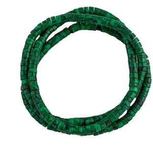 May include: A strand of green malachite beads, arranged in a circle.