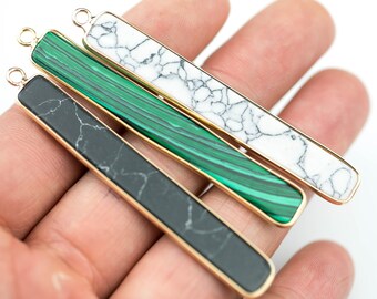 May include: Three gold-rimmed bar pendants with different marble patterns: black, green, and white.