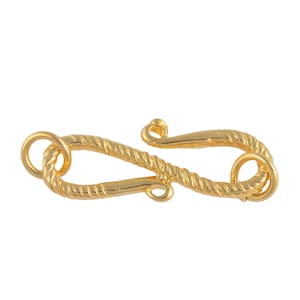 May include: Gold-toned metal clasp with a rope-like design. The clasp has two loops for attaching to a necklace or bracelet.