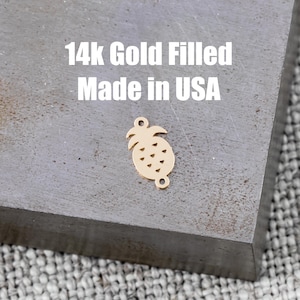 May include: Gold-filled pineapple charm with a detailed design. 14k Gold Filled Made in USA.