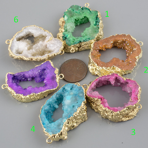 May include: Six agate slices with gold-plated edges and a hole for hanging. The slices are in various colors, including white, green, orange, purple, blue, and pink.
