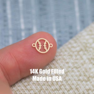 May include: A gold-filled baseball charm with a jump ring. 14K Gold Filled Made in USA.