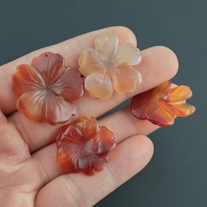 Carnelian 3d Flower Figurine About 24mm across Pre-charged- drilled on top to attach to string.