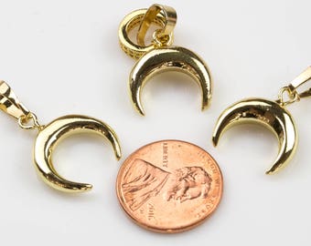 May include: Three gold crescent moon charms with a jump ring for attaching to a necklace or bracelet.