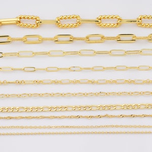 May include: A collection of ten gold chains of different styles and thicknesses, laid out horizontally on a white background.