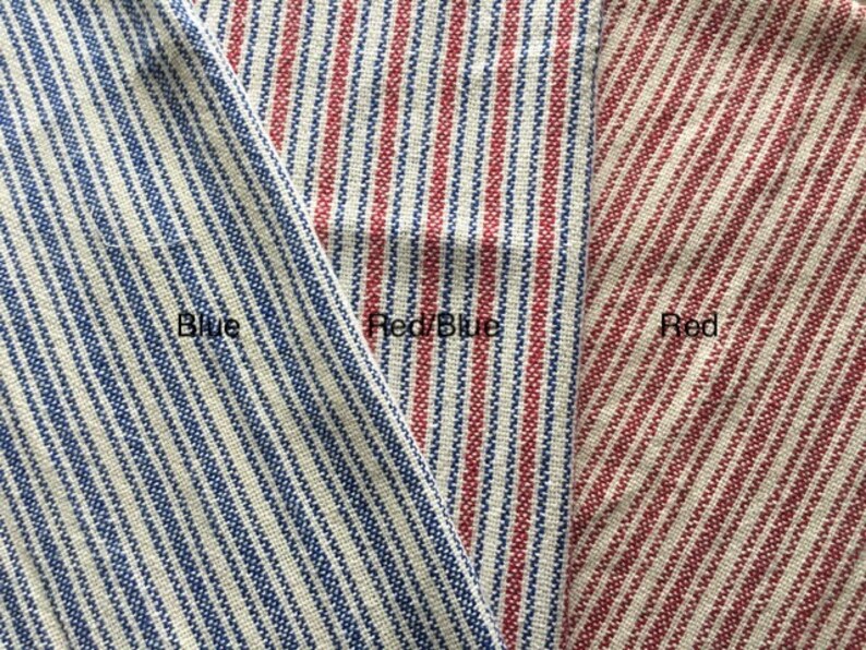 May include: Three fabric swatches with different colored stripes. The first swatch is blue and white stripes, the second swatch is red and blue stripes, and the third swatch is red and white stripes.