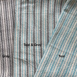 May include: Close-up of three fabric swatches with different striped patterns. The swatches are labeled "Gray", "Teal & Gray", and "Teal".