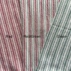 May include: Three fabric swatches with red and white stripes, red and green stripes, and green and white stripes. The swatches are labeled "Red", "Red/Green", and "Green".