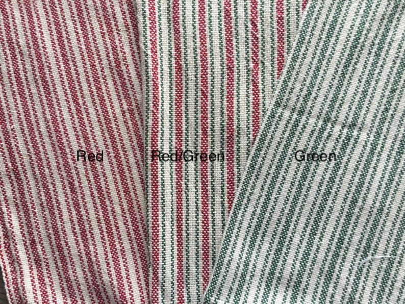 May include: Three fabric swatches with red and white stripes, red and green stripes, and green and white stripes. The swatches are labeled "Red", "Red/Green", and "Green".