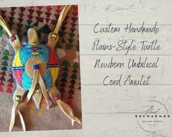 May include: A handmade beaded turtle amulet in the style of the Plains Indians. The turtle is made of leather and is decorated with blue, red, yellow, and white beads. The amulet has three leather straps for attaching it to a cord. The text "Custom Handmade Plains-Style Turtle Newborn Umbilical Cord Amulet" is visible in the image.