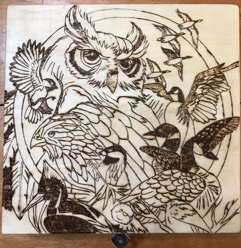 Cigar style box wood burned with a bird compilation