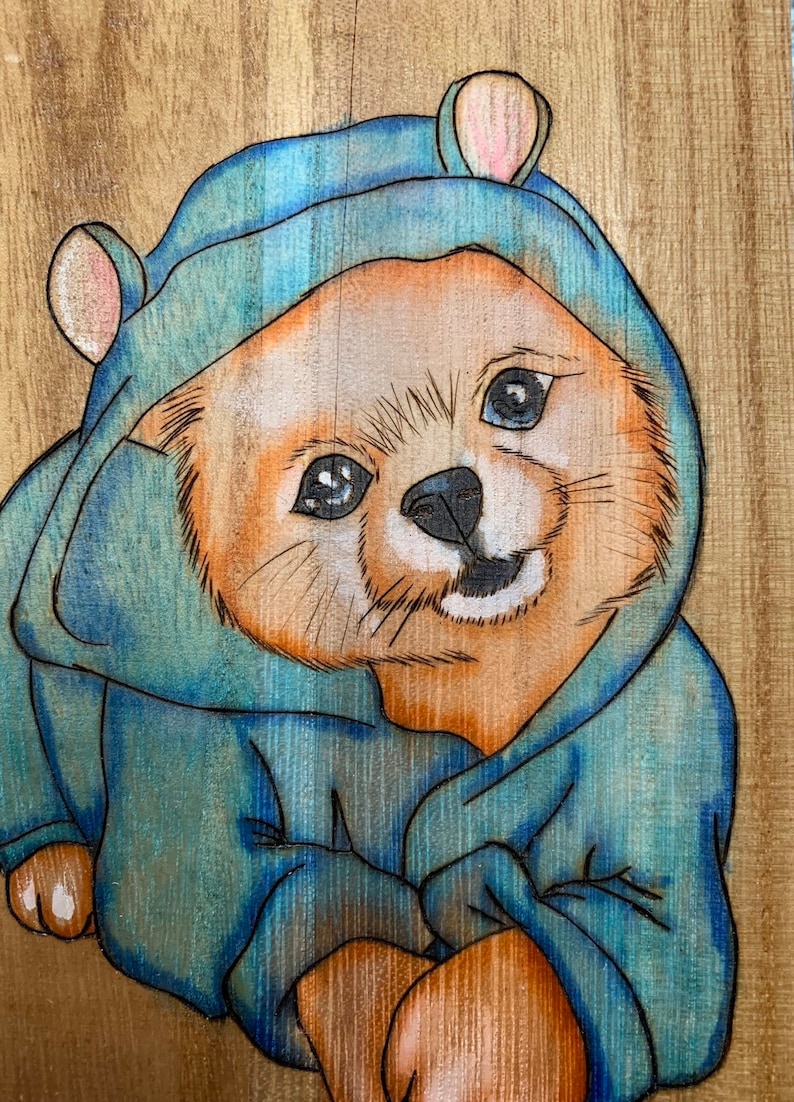 Rectangular shaped box wood birned with a puppy wearing pajamas
