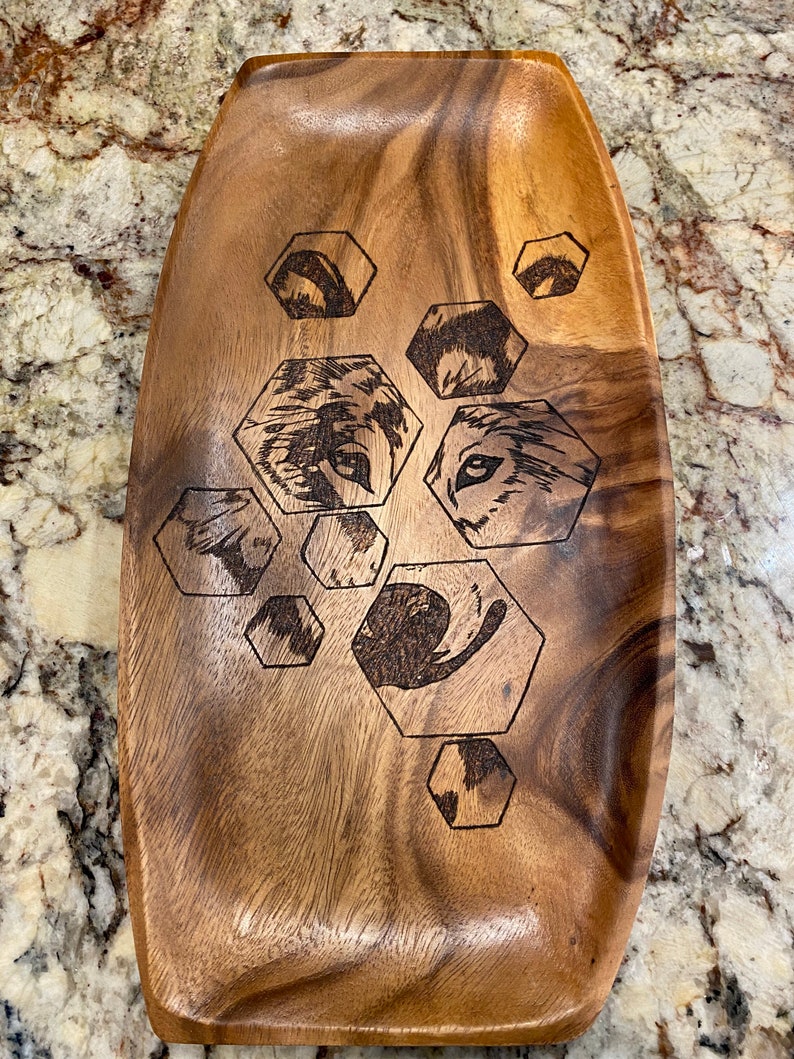 Gorgeous wooden platter wood burned with hexagons and a wolf