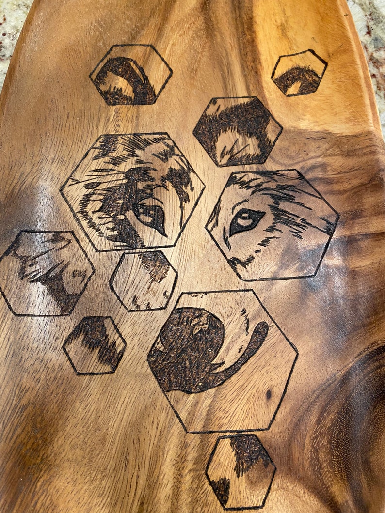 Gorgeous wooden platter wood burned with hexagons and a wolf
