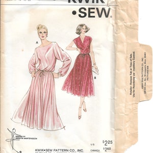 May include: Vintage Kwik Sew sewing pattern 926 featuring two dress designs. The pattern envelope shows illustrations of the dresses in pink, with the Kwik Sew logo and designer information. Sizes available are 14, 16, 18, and 20.