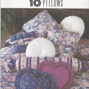 May include: A sewing pattern for 10 pillows, featuring a variety of shapes and designs, including round, heart, and rectangular pillows. The pattern includes instructions for making pillows with different fabrics and embellishments. The pattern is from Simplicity House and is for one size.