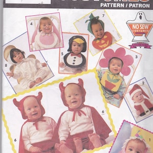 May include: A sewing pattern for making baby costumes. The pattern includes instructions for making a variety of costumes, including a penguin, a devil, a flower, a pumpkin, an angel, and a clown. The pattern is from Simplicity and is for size one.