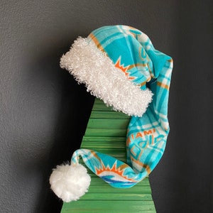 NFL Miami Dolphins plaid fleece with white furry fleece trim and 3 inch pom pom
