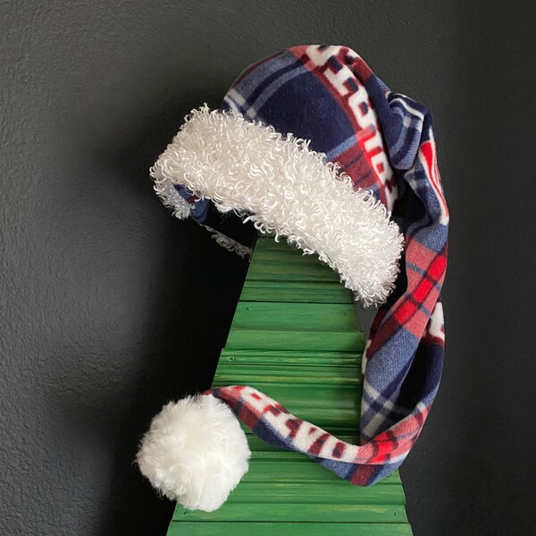 NFL New England Patriots plaid fleece with white furry fleece trim and 3 inch pom pom