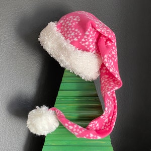 Pink with White Hearts print fleece with white furry fleece trim and 3 inch pom pom